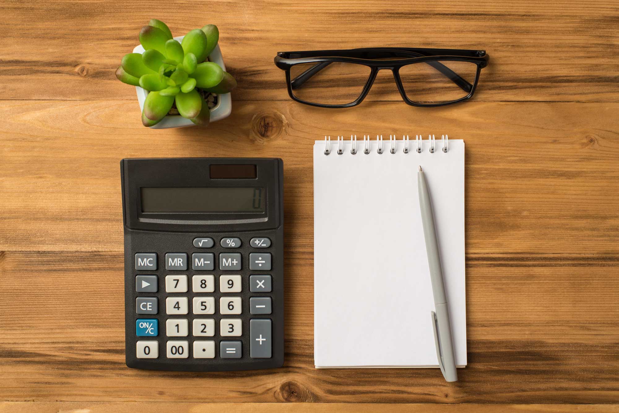 photo of a calculator on a desk